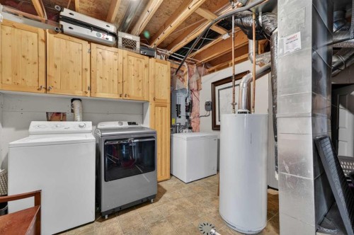 44 Bridlepost Green Sw, Calgary, AB - Indoor Photo Showing Laundry Room