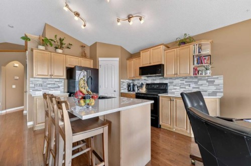 44 Bridlepost Green Sw, Calgary, AB - Indoor Photo Showing Kitchen
