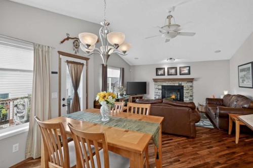112 Prestwick Point Se, Calgary, AB - Indoor Photo Showing Dining Room With Fireplace