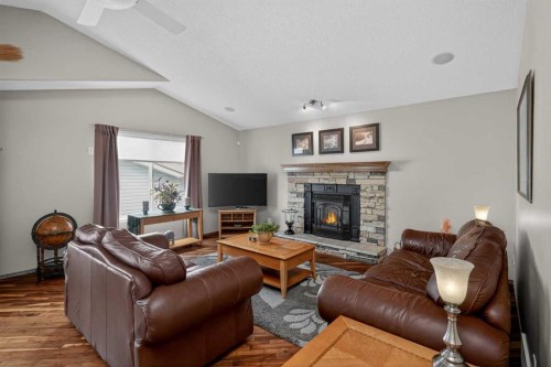 112 Prestwick Point Se, Calgary, AB - Indoor Photo Showing Living Room With Fireplace