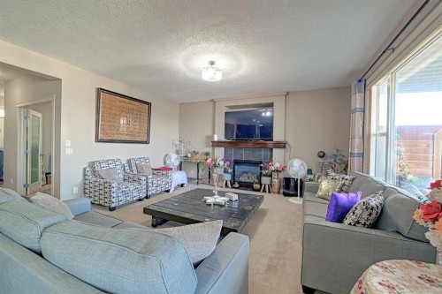 247 Pantego Way Nw, Calgary, AB - Indoor Photo Showing Living Room With Fireplace