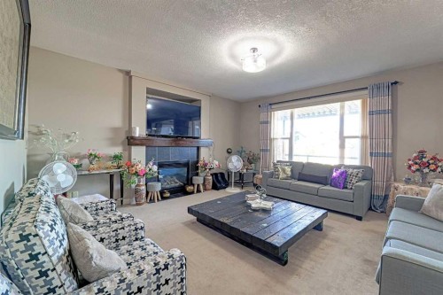 247 Pantego Way Nw, Calgary, AB - Indoor Photo Showing Living Room With Fireplace