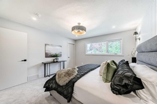 1115 Lake Wapta Road Se, Calgary, AB - Indoor Photo Showing Bedroom