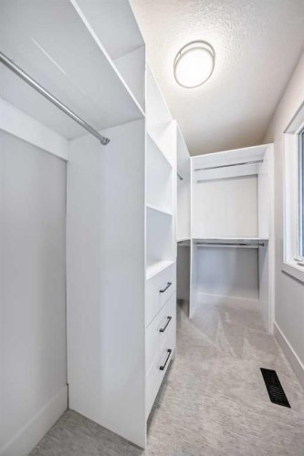 1115 Lake Wapta Road Se, Calgary, AB - Indoor With Storage