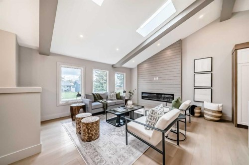 1115 Lake Wapta Road Se, Calgary, AB - Indoor Photo Showing Living Room With Fireplace