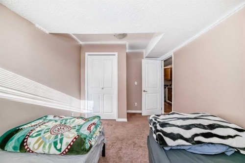 36 Saddleland Court Ne, Calgary, AB - Indoor Photo Showing Bedroom