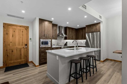 310B-1012 Spring Creek Drive West, Canmore, AB - Indoor Photo Showing Kitchen With Stainless Steel Kitchen With Upgraded Kitchen