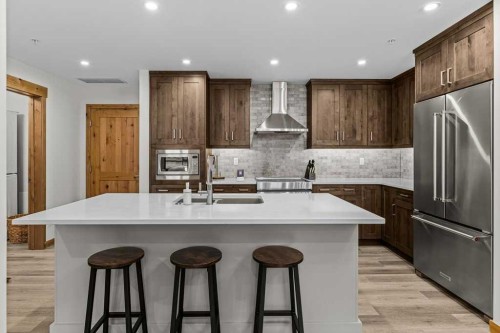 310B-1012 Spring Creek Drive West, Canmore, AB - Indoor Photo Showing Kitchen With Stainless Steel Kitchen With Upgraded Kitchen