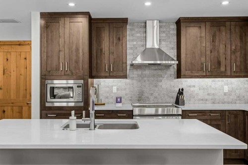310B-1012 Spring Creek Drive West, Canmore, AB - Indoor Photo Showing Kitchen With Double Sink With Upgraded Kitchen
