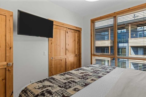 310B-1012 Spring Creek Drive West, Canmore, AB - Indoor Photo Showing Bedroom