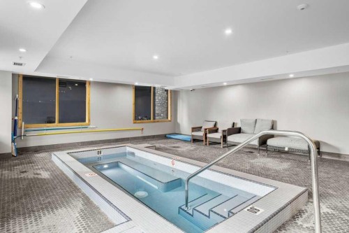 310B-1012 Spring Creek Drive West, Canmore, AB - Indoor Photo Showing Other Room With In Ground Pool