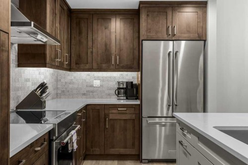 310B-1012 Spring Creek Drive West, Canmore, AB - Indoor Photo Showing Kitchen With Stainless Steel Kitchen