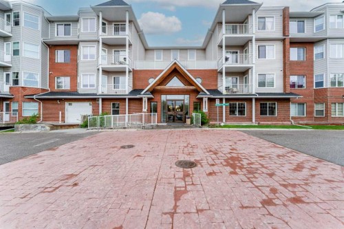 206-8 Prestwick Pond Terrace Se, Calgary, AB - Outdoor With Balcony With Facade