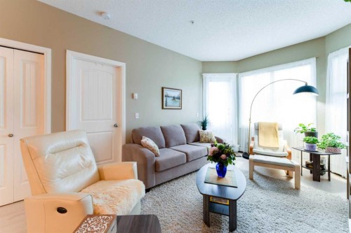 206-8 Prestwick Pond Terrace Se, Calgary, AB - Indoor Photo Showing Living Room