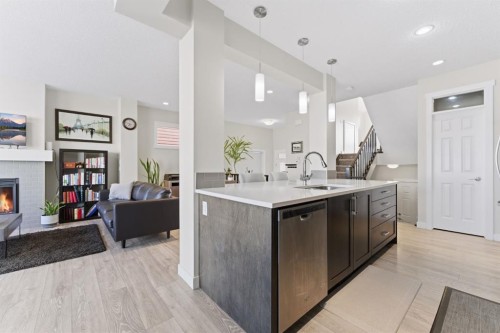 9 Sage Bluff Rise Nw, Calgary, AB - Indoor Photo Showing Kitchen With Fireplace