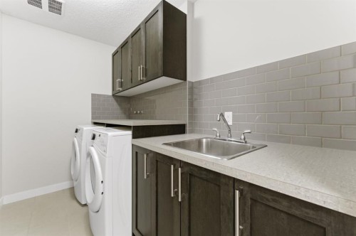 9 Sage Bluff Rise Nw, Calgary, AB - Indoor Photo Showing Laundry Room