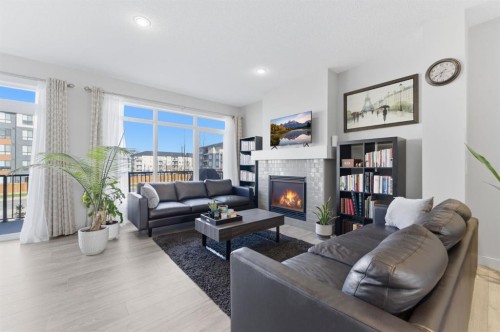 9 Sage Bluff Rise Nw, Calgary, AB - Indoor Photo Showing Living Room With Fireplace