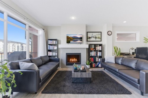 9 Sage Bluff Rise Nw, Calgary, AB - Indoor Photo Showing Living Room With Fireplace