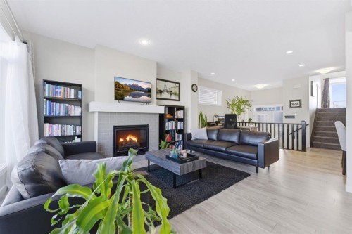 9 Sage Bluff Rise Nw, Calgary, AB - Indoor Photo Showing Living Room With Fireplace