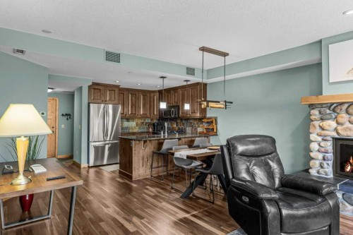 310-600 Spring Creek Drive, Canmore, AB - Indoor With Fireplace