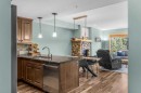 310-600 Spring Creek Drive, Canmore, AB  - Indoor With Fireplace 