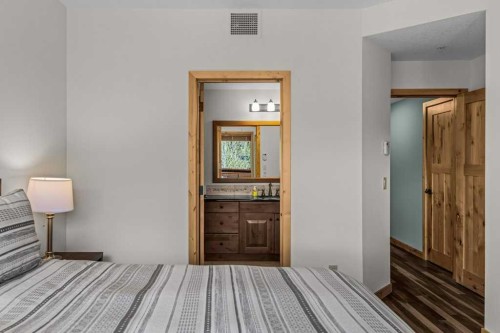 310-600 Spring Creek Drive, Canmore, AB - Indoor Photo Showing Bedroom