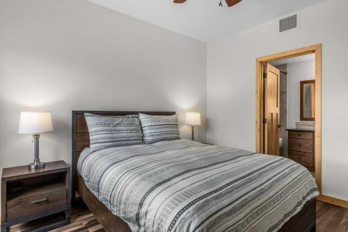 310-600 Spring Creek Drive, Canmore, AB - Indoor Photo Showing Bedroom