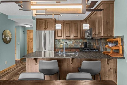 310-600 Spring Creek Drive, Canmore, AB - Indoor Photo Showing Kitchen
