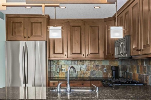 310-600 Spring Creek Drive, Canmore, AB - Indoor Photo Showing Kitchen With Double Sink With Upgraded Kitchen