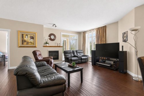 7305-14 Hemlock Crescent Sw, Calgary, AB - Indoor Photo Showing Living Room With Fireplace