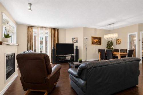 7305-14 Hemlock Crescent Sw, Calgary, AB - Indoor Photo Showing Living Room With Fireplace