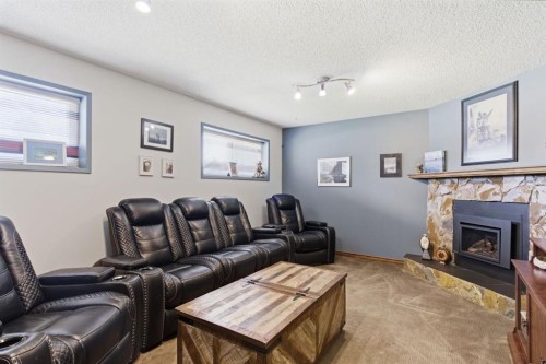 5012 Valiant Drive Nw, Calgary, AB - Indoor Photo Showing Living Room With Fireplace