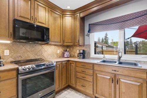 5012 Valiant Drive Nw, Calgary, AB - Indoor Photo Showing Kitchen With Stainless Steel Kitchen With Double Sink