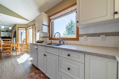 76 Sunset Crescent, Okotoks, AB - Indoor Photo Showing Kitchen With Double Sink