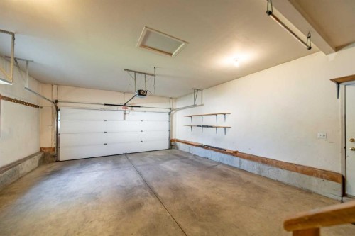 76 Sunset Crescent, Okotoks, AB - Indoor Photo Showing Garage