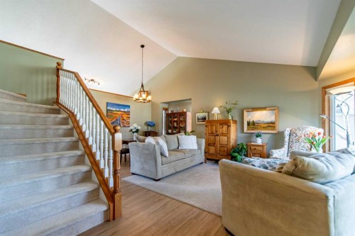 76 Sunset Crescent, Okotoks, AB - Indoor Photo Showing Living Room With Fireplace