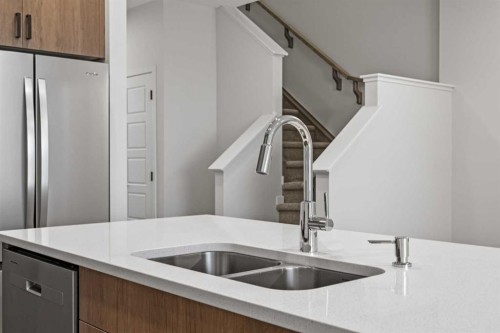 117 Bridgeport Gate, Chestermere, AB - Indoor Photo Showing Kitchen With Double Sink