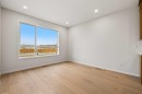117 Bridgeport Gate, Chestermere, AB  - Indoor Photo Showing Other Room With Fireplace 