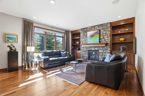 12 Aspen Cliff Close Sw, Calgary, AB - Indoor Photo Showing Living Room With Fireplace