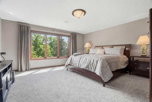 12 Aspen Cliff Close Sw, Calgary, AB - Indoor Photo Showing Bedroom