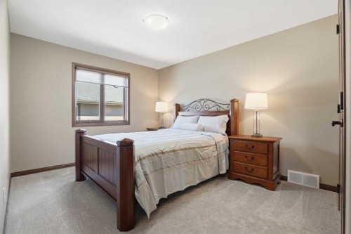 12 Aspen Cliff Close Sw, Calgary, AB - Indoor Photo Showing Bedroom