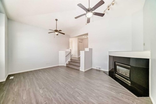 13 Harvest Park Place Ne, Calgary, AB - Indoor With Fireplace