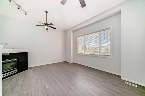 13 Harvest Park Place Ne, Calgary, AB - Indoor With Fireplace