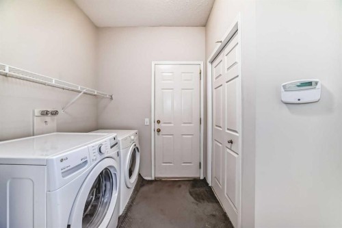 68 Scenic View Close Nw, Calgary, AB - Indoor Photo Showing Laundry Room