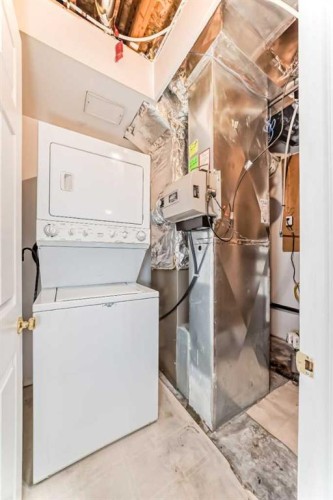 68 Scenic View Close Nw, Calgary, AB - Indoor Photo Showing Laundry Room