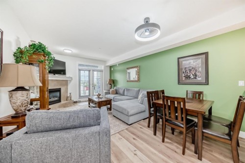 111-1005B Westmount Drive, Strathmore, AB - Indoor Photo Showing Living Room With Fireplace
