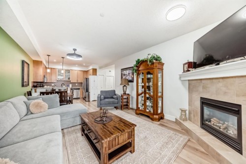111-1005B Westmount Drive, Strathmore, AB - Indoor Photo Showing Living Room With Fireplace