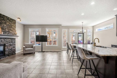 495 Cranford Drive Se, Calgary, AB - Indoor Photo Showing Living Room With Fireplace