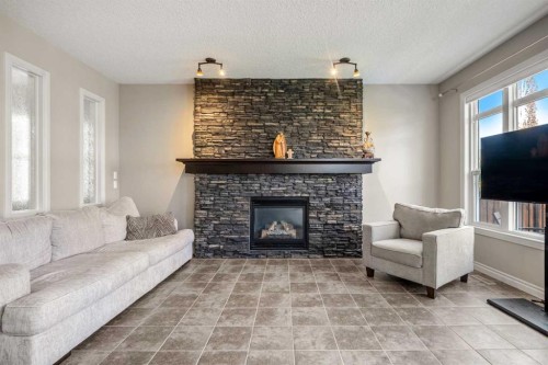 495 Cranford Drive Se, Calgary, AB - Indoor Photo Showing Living Room With Fireplace