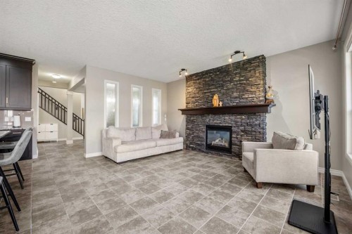 495 Cranford Drive Se, Calgary, AB - Indoor Photo Showing Living Room With Fireplace